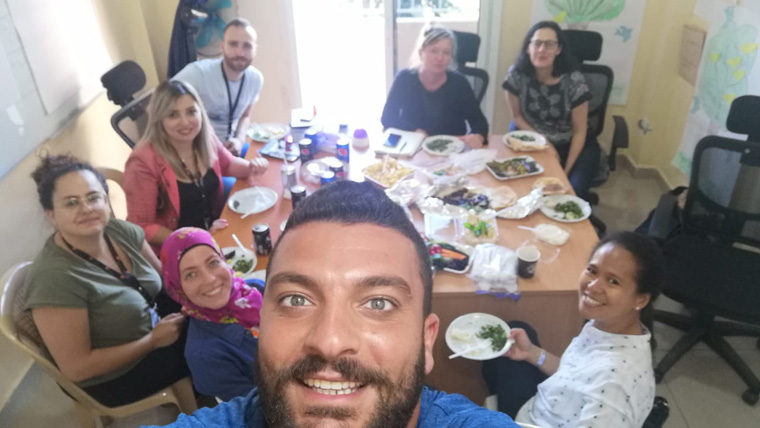 Aimyleen (bottom right) joins child protection colleagues in Lebanon