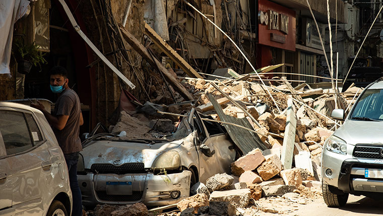 Cars under the rubble of buildings destroyed in Beirut's blast