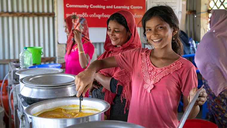 Raju,12, can cook with her mum at the Community Kitchen in their refugee camp in Bangladesh