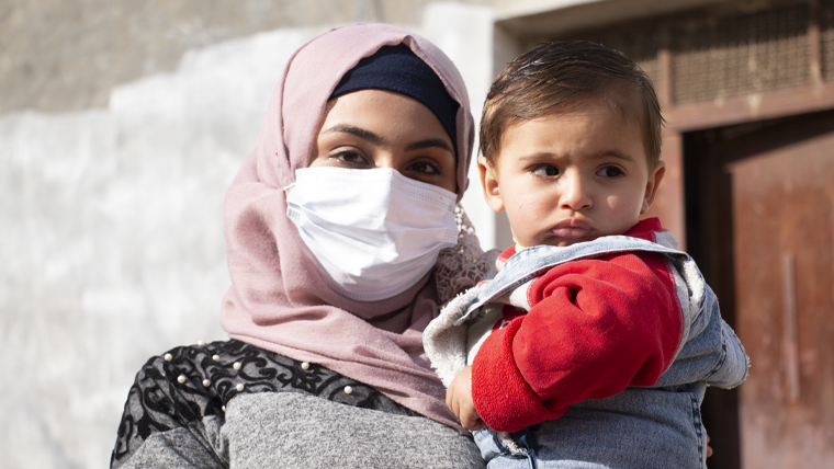 Syrian refugee Fatimah, with her baby son, now living in Jordan