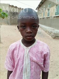 Choose a child to sponsor, like this little boy from Mbella, Samba age 8