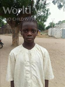 Choose a child to sponsor, like this little boy from Mbella, Ngor age 9