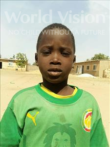 Choose a child to sponsor, like this little boy from Loul, Jean Pierre Diogoye age 7