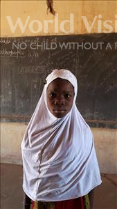 Choose a child to sponsor, like this little girl from Komabangou, Hafissatou age 7