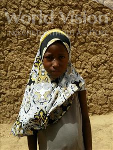 Choose a child to sponsor, like this little girl from Komabangou, Rouhana age 7